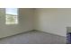 Neutral bedroom with carpet, white walls, and a window lets in natural light at 5920 Silver Palm Blvd, Bradenton, FL 34211