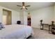Bedroom featuring comfortable sleeping arrangements with a desk, ceiling fan, and easy access to other areas at 5920 Silver Palm Blvd, Bradenton, FL 34211