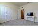 Bedroom with carpet flooring, closet, and neutral walls at 5920 Silver Palm Blvd, Bradenton, FL 34211