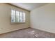 Neutral bedroom with carpet flooring, white walls and plantation shutters on the window at 5920 Silver Palm Blvd, Bradenton, FL 34211
