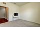 Bedroom featuring carpet flooring, a TV, and an open door frame at 5920 Silver Palm Blvd, Bradenton, FL 34211