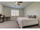 Bedroom with carpet flooring, desk, and a double bed at 5920 Silver Palm Blvd, Bradenton, FL 34211
