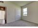 Bright bedroom features carpet, closet, and a window with neighborhood views at 5920 Silver Palm Blvd, Bradenton, FL 34211