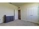 Bedroom with gray carpet, gray dresser, and a double door closet at 5920 Silver Palm Blvd, Bradenton, FL 34211