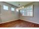 Bright dining room offers wood floors, neutral paint, and a statement light fixture at 5920 Silver Palm Blvd, Bradenton, FL 34211