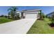 Well-maintained single-Gathering home with a concrete driveway and attached two-car garage at 5920 Silver Palm Blvd, Bradenton, FL 34211