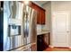 Kitchen with stainless steel appliances, dark wood cabinets, and granite countertops at 5920 Silver Palm Blvd, Bradenton, FL 34211