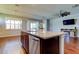 Kitchen with a stainless steel dishwasher and a granite countertop kitchen island at 5920 Silver Palm Blvd, Bradenton, FL 34211