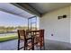 Enjoy views of the lake and fountain from the screened-in covered patio, complete with seating at 5920 Silver Palm Blvd, Bradenton, FL 34211