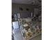 Main bedroom with floral bedding, and & wall decor at 611 N Bradford Ave, Tampa, FL 33609