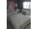 Bright bedroom with crib, white furniture and good light at 611 N Bradford Ave, Tampa, FL 33609