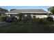Charming single-story home with well-manicured lawn, mature landscaping, and cozy curb appeal at 611 N Bradford Ave, Tampa, FL 33609