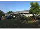 Charming single-story home with well-manicured lawn, mature landscaping, and cozy curb appeal at 611 N Bradford Ave, Tampa, FL 33609