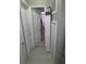 Hallway with tile floor, closet doors, and access to the bathroom at 611 N Bradford Ave, Tampa, FL 33609