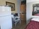 Cozy kitchenette with compact appliances, complemented by a simple dining setup at 611 N Bradford Ave, Tampa, FL 33609