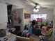 Bright and airy living room with ceiling fan, with lots of baby items present at 611 N Bradford Ave, Tampa, FL 33609