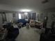 Comfortable living room with bright light fixture, tile flooring, and elegant decor at 611 N Bradford Ave, Tampa, FL 33609