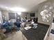 Cozy living room featuring modern decor, a comfortable sofa, and abundant natural light at 611 N Bradford Ave, Tampa, FL 33609