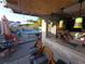 Outdoor patio with bar and seating areas overlooking the pool at 611 N Bradford Ave, Tampa, FL 33609
