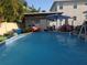 Above-ground pool with accessories and an open patio area at 611 N Bradford Ave, Tampa, FL 33609