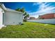 View of the expansive backyard showing the green lawn and privacy fence at 6215 N 44Th St, Tampa, FL 33610