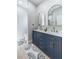 Modern bathroom featuring dual sinks and gold hardware at 6215 N 44Th St, Tampa, FL 33610