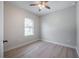 Bright bedroom features a ceiling fan, wood floors, and a window for natural light at 6215 N 44Th St, Tampa, FL 33610