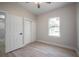 Well-lit bedroom featuring a ceiling fan, closet, and ample natural light at 6215 N 44Th St, Tampa, FL 33610