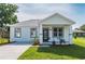 Charming single-story home featuring a modern design, fresh landscaping, and a welcoming entrance at 6215 N 44Th St, Tampa, FL 33610