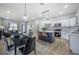 Stylish kitchen with stainless steel appliances, quartz countertops, and a cozy dining area at 6215 N 44Th St, Tampa, FL 33610