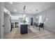 Modern kitchen with white cabinets, stainless steel appliances, and a center island at 6215 N 44Th St, Tampa, FL 33610