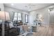 Comfortable living area featuring a plush sofa, stylish decor, and plenty of natural light at 6215 N 44Th St, Tampa, FL 33610