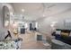 Bright and open-concept living space with modern decor, wood floors, and recessed lighting at 6215 N 44Th St, Tampa, FL 33610