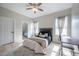 Comfortable bedroom with natural light, neutral tones, and an ensuite bathroom at 6215 N 44Th St, Tampa, FL 33610