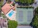 An aerial view showcasing a swimming pool and tennis courts near the community at 6262 142Nd N Ave # 607, Clearwater, FL 33760
