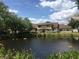 A scenic view of the home from across the pond with a view of the serene water feature at 6262 142Nd N Ave # 607, Clearwater, FL 33760