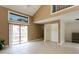 Bright and airy living room featuring vaulted ceilings, neutral colors, and a sliding door to the patio at 6262 142Nd N Ave # 607, Clearwater, FL 33760