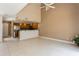 Open-concept living room features tall ceilings, a ceiling fan, and adjoins the kitchen space at 6262 142Nd N Ave # 607, Clearwater, FL 33760
