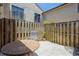 Private courtyard patio includes a table, chair, and wooden fence for outdoor relaxation at 6262 142Nd N Ave # 607, Clearwater, FL 33760