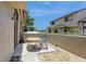 Outdoor patio seating with views of the surrounding townhome exteriors and well-maintained green spaces at 6262 142Nd N Ave # 607, Clearwater, FL 33760