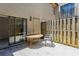 Private courtyard patio includes a table, chair, sliding glass door, and door for outdoor living and relaxation at 6262 142Nd N Ave # 607, Clearwater, FL 33760