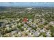 An aerial view of a property in a lush, green neighborhood at 627 Belted Kingfisher N Dr, Palm Harbor, FL 34683
