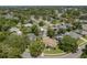 Lushly landscaped homes with private pools create a serene atmosphere in this aerial neighborhood view at 627 Belted Kingfisher N Dr, Palm Harbor, FL 34683