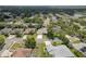 A tranquil neighborhood features well-maintained homes, mature trees, and a serene atmosphere at 627 Belted Kingfisher N Dr, Palm Harbor, FL 34683