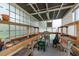 Interior view of the greenhouse with built in shelves and tables, great for gardening at 627 Belted Kingfisher N Dr, Palm Harbor, FL 34683