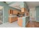 Well-equipped kitchen with light wood cabinets, a breakfast bar, and a view to the dining area at 627 Belted Kingfisher N Dr, Palm Harbor, FL 34683