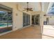 Outdoor patio with built-in kitchen and barbecue area, ceiling fan, and access to pool and spa at 627 Belted Kingfisher N Dr, Palm Harbor, FL 34683