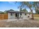 Cozy backyard features a patio and seating area with privacy fence at 6347 S Lansdale Cir, Tampa, FL 33616