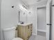 Bathroom featuring a toilet, light wood vanity with drawers and a marble countertop at 6347 S Lansdale Cir, Tampa, FL 33616