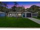 Charming single-story home featuring a well-manicured lawn and a freshly painted exterior at 6347 S Lansdale Cir, Tampa, FL 33616